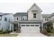 Charming two-story home with a two-car garage and stone accents at 2089 Florine Dr, Apex, NC 27502