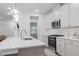 Modern kitchen with white cabinets, stainless steel appliances, and an island at 2089 Florine Dr, Apex, NC 27502