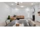 Bright living room features tan leather couches, fireplace and hardwood floors at 2089 Florine Dr, Apex, NC 27502