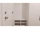 Mudroom featuring a built-in bench with storage and hooks, and a white exterior door at 2089 Florine Dr, Apex, NC 27502