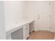 Dedicated office area with ample counter space, drawers, and a white exterior door at 2089 Florine Dr, Apex, NC 27502