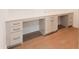 Office with built-in desks, drawers, cabinets and hardwood floors at 2089 Florine Dr, Apex, NC 27502
