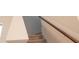 Stairwell with oak handrail and neutral carpet at 2089 Florine Dr, Apex, NC 27502