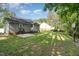 Large backyard with trees, a patio and a basketball hoop at 2112 Ballston Pl, Knightdale, NC 27545