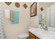 Well lit bathroom featuring a sink with vanity, decorative towels and wall decor at 2112 Ballston Pl, Knightdale, NC 27545