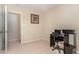 Another view of cozy bedroom with neutral carpeting, a window with curtains, and a small desk with a chair at 2112 Ballston Pl, Knightdale, NC 27545