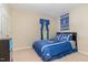 Bedroom featuring Duke-themed decor, including bedding and wall hangings, with neutral carpet at 2112 Ballston Pl, Knightdale, NC 27545