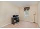 Cozy bedroom with neutral carpeting, a window with curtains, and a small desk with a chair at 2112 Ballston Pl, Knightdale, NC 27545
