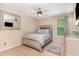 Comfortable bedroom with a silver-framed bed, ceiling fan, neutral carpet, and window at 2112 Ballston Pl, Knightdale, NC 27545