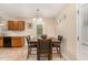 Cozy dining area with a wooden table, four chairs, and simple decor at 2112 Ballston Pl, Knightdale, NC 27545