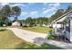 Long driveway leading to the house with green grass and landscaping at 2112 Ballston Pl, Knightdale, NC 27545