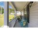Relaxing front porch featuring comfortable seating and a view of the surrounding neighborhood at 2112 Ballston Pl, Knightdale, NC 27545