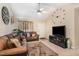 Well-decorated living room with a large sectional sofa, TV, and decorative accents at 2112 Ballston Pl, Knightdale, NC 27545