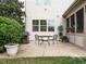 Cozy back patio with outdoor dining set and grill, ideal for entertaining and outdoor meals at 212 Listening Ridge Ln, Cary, NC 27519