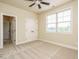 Bedroom featuring neutral walls, carpet, double doors and natural light at 212 Listening Ridge Ln, Cary, NC 27519