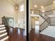 Elegant foyer featuring a grand staircase, high ceilings, and abundant natural light at 212 Listening Ridge Ln, Cary, NC 27519