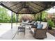 Inviting gazebo featuring comfortable lounge furniture and ambient string lights at 212 Listening Ridge Ln, Cary, NC 27519