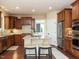 Well-equipped kitchen featuring a center island, stainless steel appliances, and ample cabinet space at 212 Listening Ridge Ln, Cary, NC 27519
