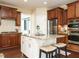 Modern kitchen with granite counters, stainless steel appliances, and a functional center island at 212 Listening Ridge Ln, Cary, NC 27519