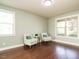 Comfortable living room featuring hardwood floors, neutral paint, and ample natural light at 212 Listening Ridge Ln, Cary, NC 27519