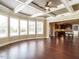 Bright living room with hardwood floors, coffered ceilings, and a view into the kitchen at 212 Listening Ridge Ln, Cary, NC 27519