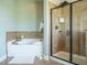 Luxurious main bathroom with soaking tub and walk-in shower at 212 Listening Ridge Ln, Cary, NC 27519