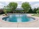 Stunning backyard pool with a gazebo and lush greenery, perfect for relaxation and enjoyment at 212 Listening Ridge Ln, Cary, NC 27519