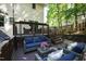 Inviting back deck features comfortable seating and ambient string lights at 213 Beechtree Dr, Cary, NC 27513