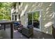 Back deck with outdoor furniture and a sliding door accessing the home's interior at 213 Beechtree Dr, Cary, NC 27513