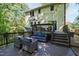 Multi-level deck with furniture and outdoor lights perfect for entertaining and relaxation at 213 Beechtree Dr, Cary, NC 27513