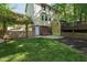 Well-manicured backyard with an accent climbing wall for outdoor fun at 213 Beechtree Dr, Cary, NC 27513
