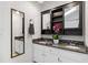 Bathroom features a double vanity, granite countertops, and a decorative orchid at 213 Beechtree Dr, Cary, NC 27513