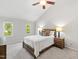 Bright bedroom features a ceiling fan, light gray walls, two windows, and neutral carpet flooring at 213 Beechtree Dr, Cary, NC 27513