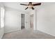 Neutrally decorated bedroom featuring a carpeted floor and large closet with an open door at 213 Beechtree Dr, Cary, NC 27513