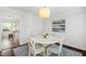 Dining room with white table and chairs, decorative rug, and natural light at 213 Beechtree Dr, Cary, NC 27513