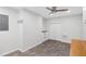 Versatile flex space with tile floors, cabinets, and modern ceiling fan at 213 Beechtree Dr, Cary, NC 27513