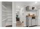 Hallway with built-in shelves and view to connecting rooms with hardwood floors at 213 Beechtree Dr, Cary, NC 27513