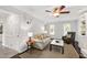 Cozy living room featuring neutral furniture, hardwood floors, and a fireplace at 213 Beechtree Dr, Cary, NC 27513