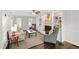 Cozy living room featuring a fireplace, built-in shelving, neutral furniture, and hardwood floors at 213 Beechtree Dr, Cary, NC 27513