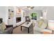 Cozy living room featuring a fireplace, built-in shelving, neutral furniture and wood floors at 213 Beechtree Dr, Cary, NC 27513