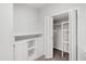 Finished storage space with cabinets and shelving behind a closet door at 213 Beechtree Dr, Cary, NC 27513