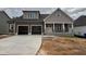 Charming two-story home showcasing a spacious two-car garage and inviting front porch at 2320 Eagle Shot Ct # 20, Fuquay Varina, NC 27526