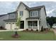 Beautiful two-story home showcasing manicured lawn, two-car garage, and welcoming covered porch at 2324 Eagle Shot Ct # 19, Fuquay Varina, NC 27526
