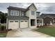 Two-story home features a two-car garage, covered porch, and nicely landscaped front yard at 2324 Eagle Shot Ct # 19, Fuquay Varina, NC 27526