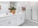 Modern bathroom with double vanity, white cabinets, large mirror, and glass-enclosed shower at 2736 Luxborough Ln, Mebane, NC 27302