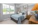Charming bedroom features a soft color palette, comfortable bed, and a large window at 2736 Luxborough Ln, Mebane, NC 27302