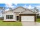 Charming single-Gathering home showcasing a brick and vinyl exterior with a two-car garage at 2736 Luxborough Ln, Mebane, NC 27302