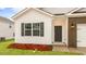Inviting exterior featuring brick accents, gray shutters and fresh landscaping at 2736 Luxborough Ln, Mebane, NC 27302