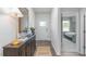 Inviting foyer showcasing a console table with wood flooring and access to a bedroom at 2736 Luxborough Ln, Mebane, NC 27302