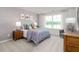 bedroom featuring a bed with stylish bedding, dresser, and a large window at 2739 Luxborough Ln, Mebane, NC 27302